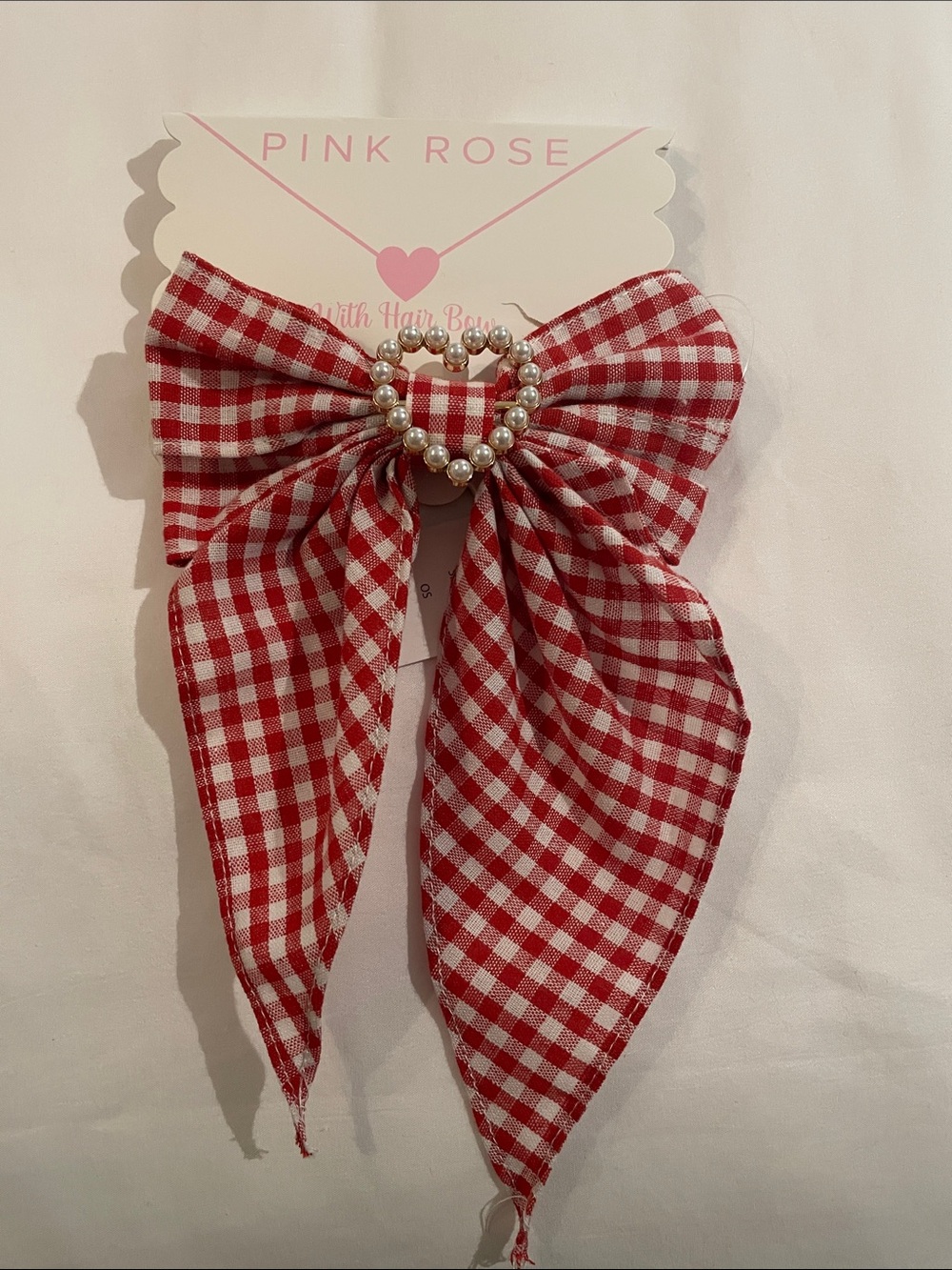 Red and white gingham clip hair bow with white pearl heart accent o/s